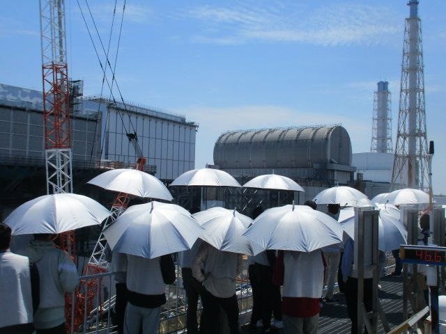 Image of people holding umbrellas